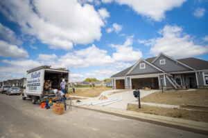 2 man crew installing gutters on a new build house in Cincinnati